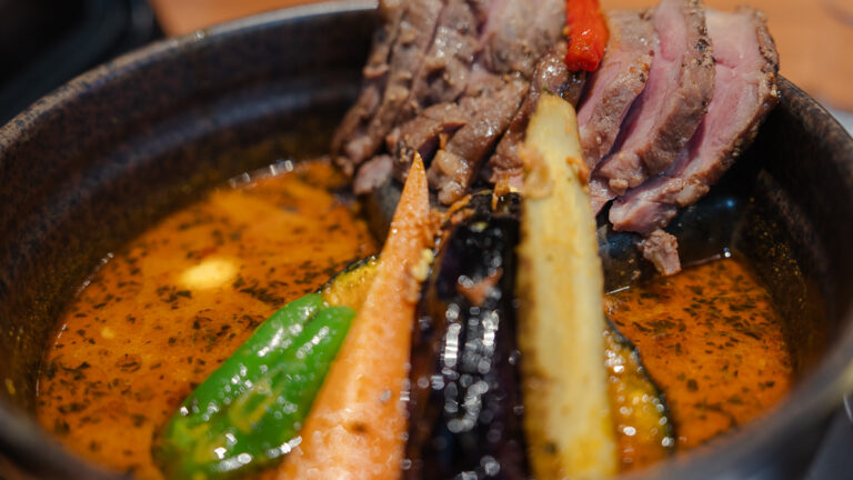 Close-up of soup curry with lamb and vegetables in Sapporo, Japan.