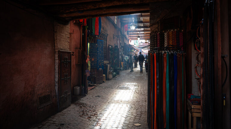 Sunlight filtering through slatted roof in a Marrakech souk.