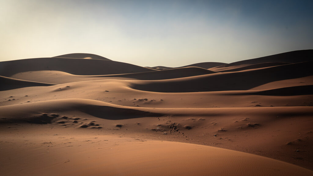 Closer view of rounded sand dunes near Erg Chigaga showing soft ridges across the desert.