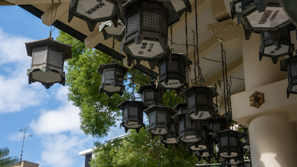 Traditional lanterns hanging on the shrine grounds at Namba Yasaka Shrine.