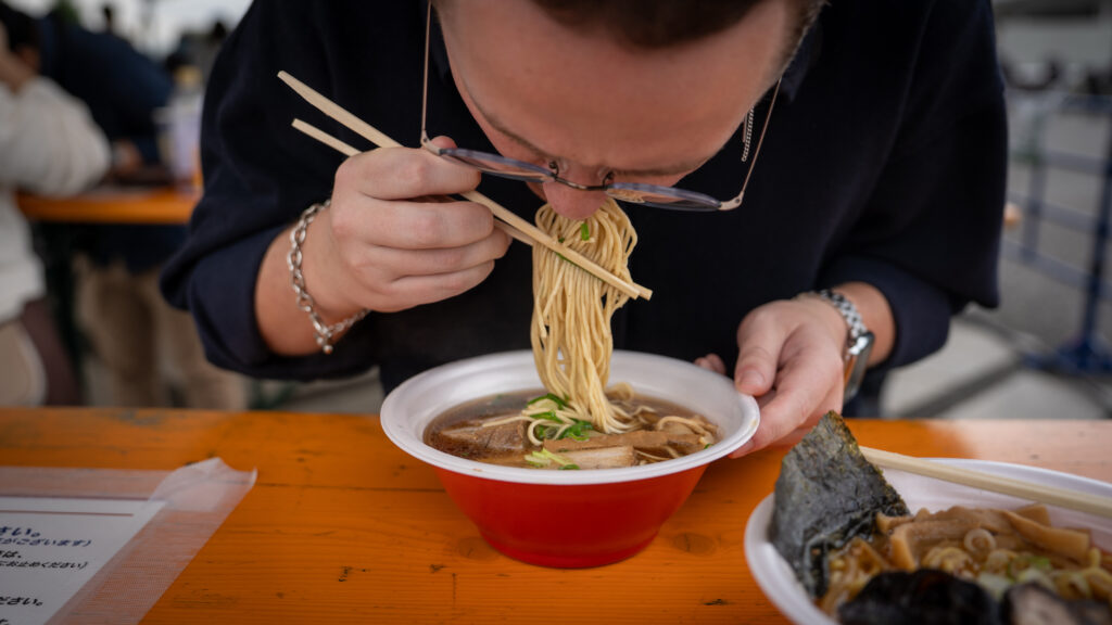 Mac enjoys a bowl of ramen at Tokyo Ramen Festa.