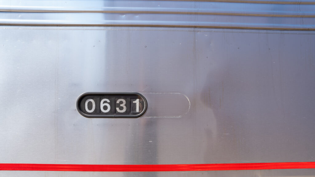 Close-up detail of Amtrak train car number 631.