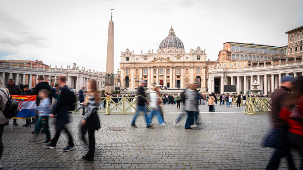 Blurred crowd exiting St Peter’s Square after Palm Sunday Mass captured with slow shutter